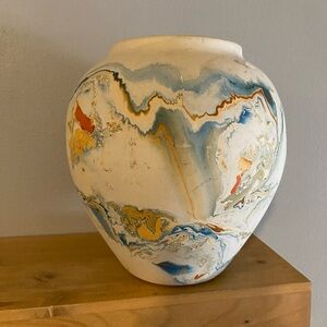 Vintage Nemadji Pottery vase with swirled blue, orange, and tan glazes.